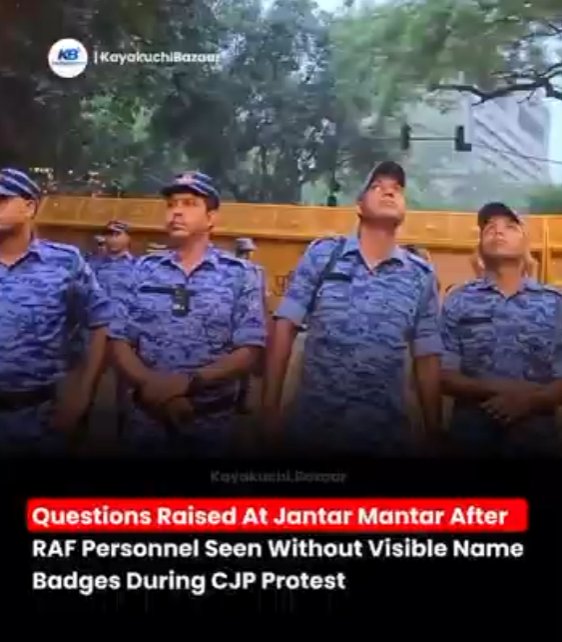 A row of RAF personnel in blue camouflage with no visible name badges